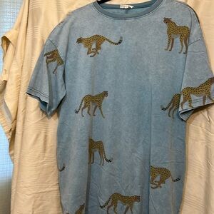 Dressed in Lala leopard tunic, it has a different brand on tag.